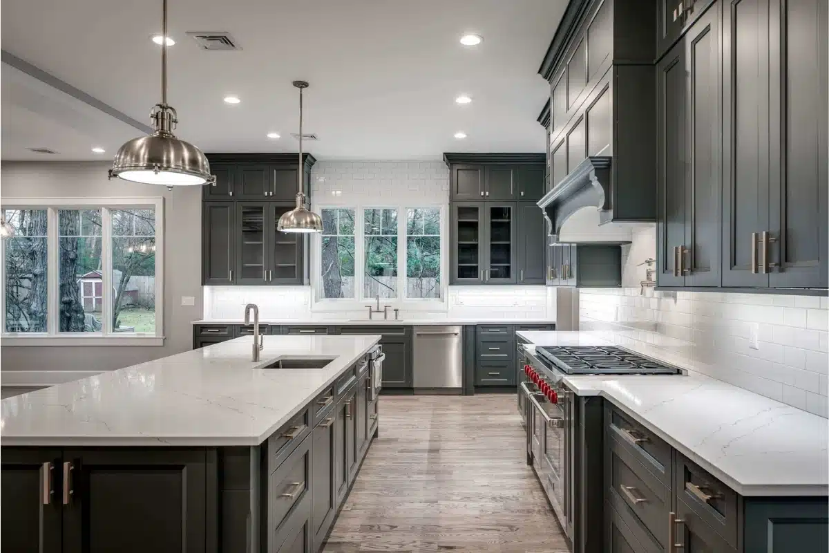 Custom cabinetry in Baltimore, MD showcased in a luxury kitchen featuring tall gray shaker cabinets, built-in storage, oversized island, and premium finishes.